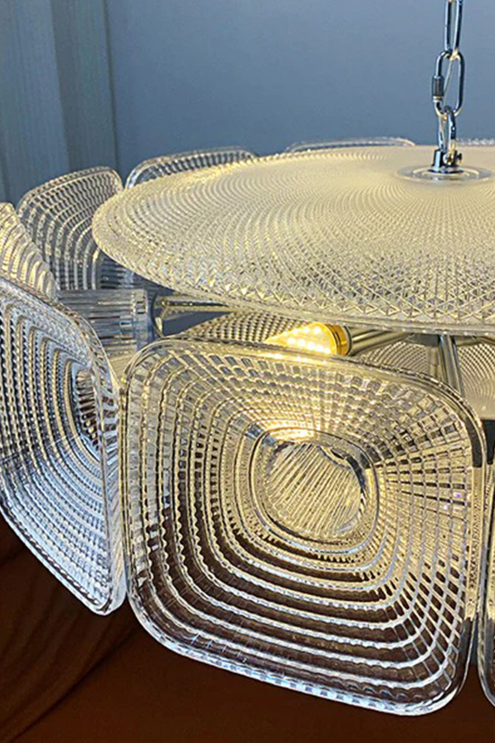 Lyra Geometric Glass Chandelier | Glass, Metal | Close-up focus on the clear textured glass block showcasing the detailed concentric square ripple design | Detail shot | vexa lamps