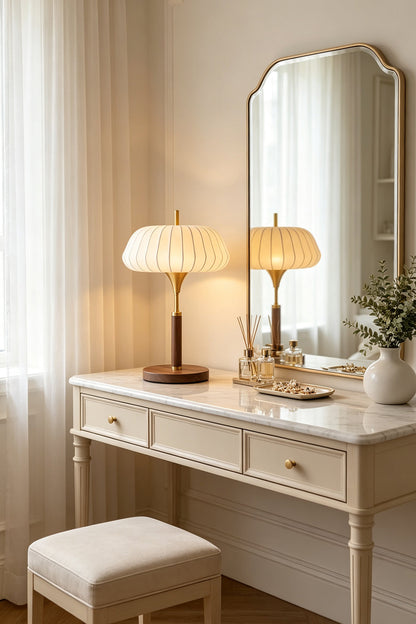 Maren Woven Silk Gourd Table Lamp | Woven Silk, Brass and Wood | Set on a classic white dressing table in front of a mirror | vexa lamps