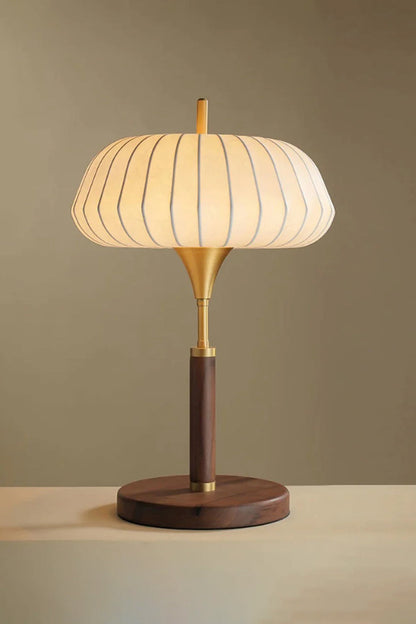 Maren Woven Silk Gourd Table Lamp | Woven Silk, Brass and Wood | Warm ambient front view highlighting the glowing silk shade | vexa lamps