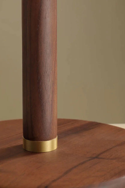 Maren Woven Silk Gourd Table Lamp | Woven Silk, Brass and Wood | Close-up detail of the smooth wooden stem and brass base ring | vexa lamps
