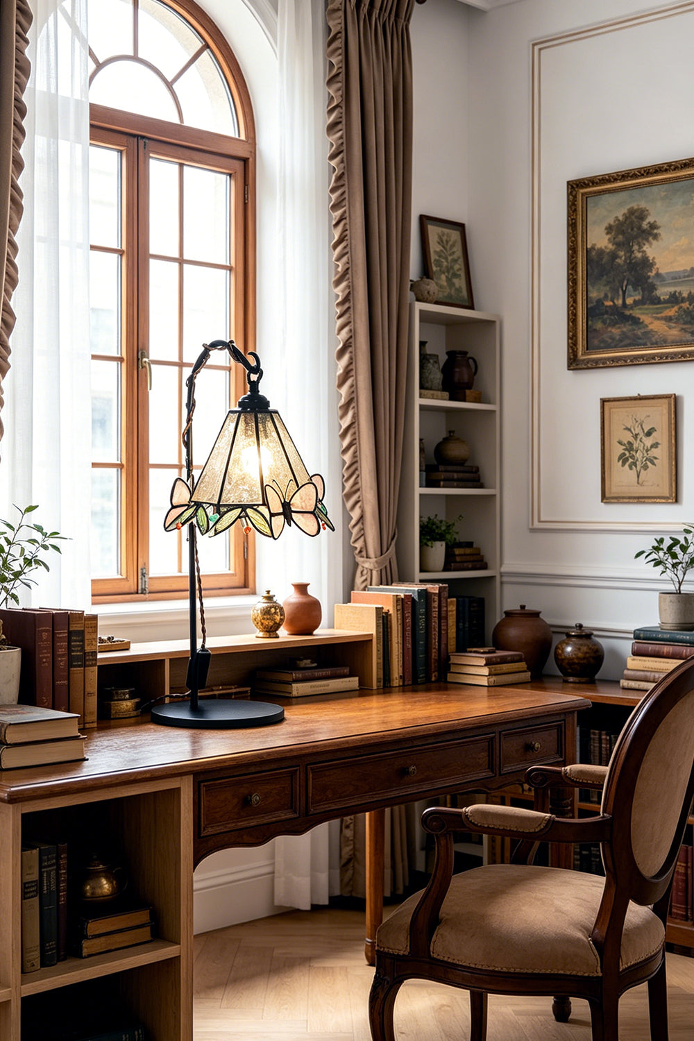 Mariposa Stained Glass Table Lamp | Glass, Metal | Enhancing a spacious home office setup on a long wooden executive desk under soft window light | vexa lamps