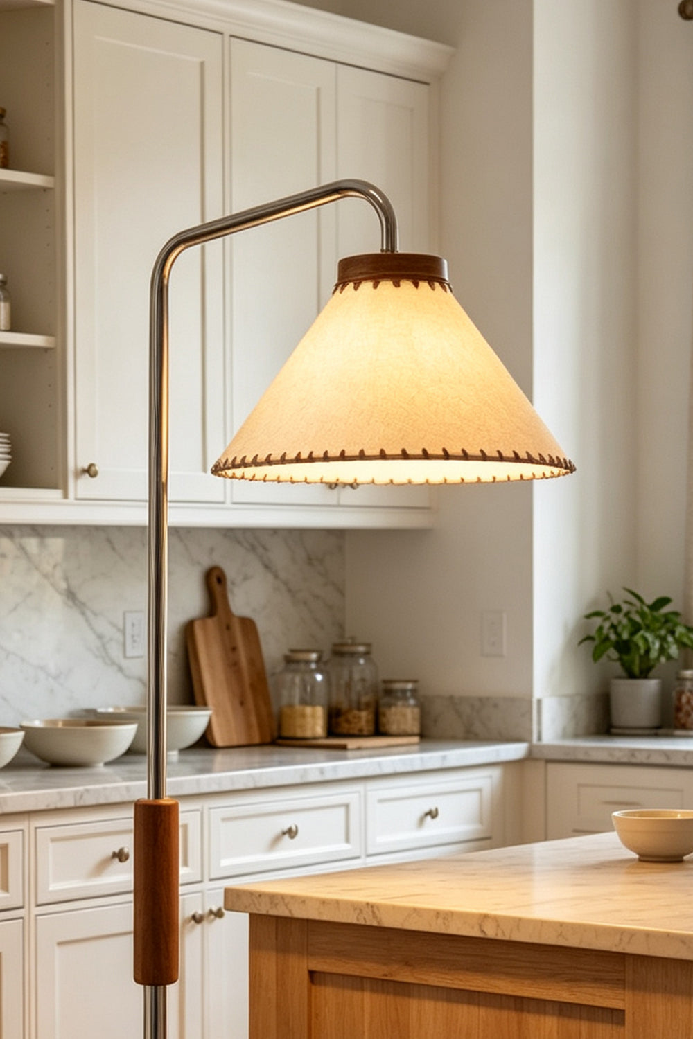Marlowe Angled Linen Reading Floor Lamp | Linen, Wood, and Chrome Metal | Medium shot focusing on the upper section of the lamp illuminating a bright rustic kitchen corner | vexa lamps