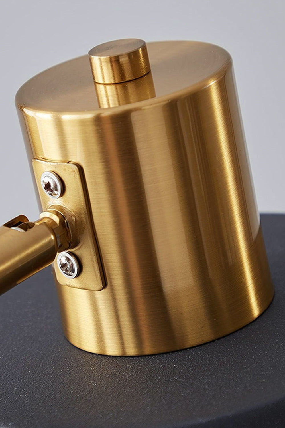 Marlowe Gooseneck Reading Floor Lamp | Matte Black and Brass | Detailed close-up of the polished gold brass top cap and shade mounting hardware | vexa lamps