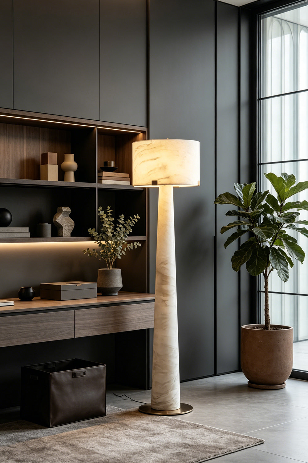 Meridian Column Alabaster Floor Lamp | Alabaster, Brass | Lit in a dark modern home office corner next to a desk | vexa lamps