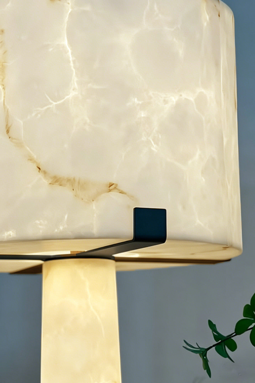 Floor Lamp Detail | Alabaster, Brass | Close-up of lit alabaster shade and brass support clips | vexa lamps