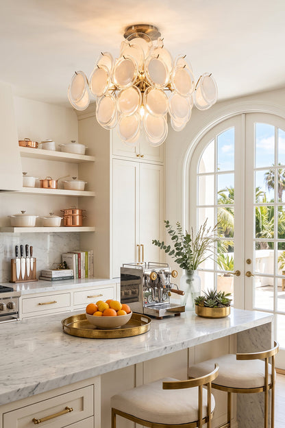 Mirella Circular Glass Pane Ceiling Light | Kitchen Lighting | Hanging as an elegant overhead light fixture casting a warm glow over a white marble island counter in a bright luxury kitchen | vexa lamps