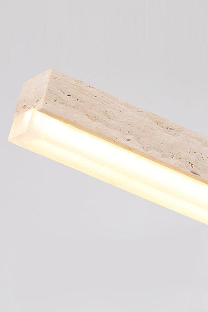 Detailed side view of lit travertine linear lamp | Travertine, Acrylic | Showing the stone texture and acrylic diffuser | vexa lamps