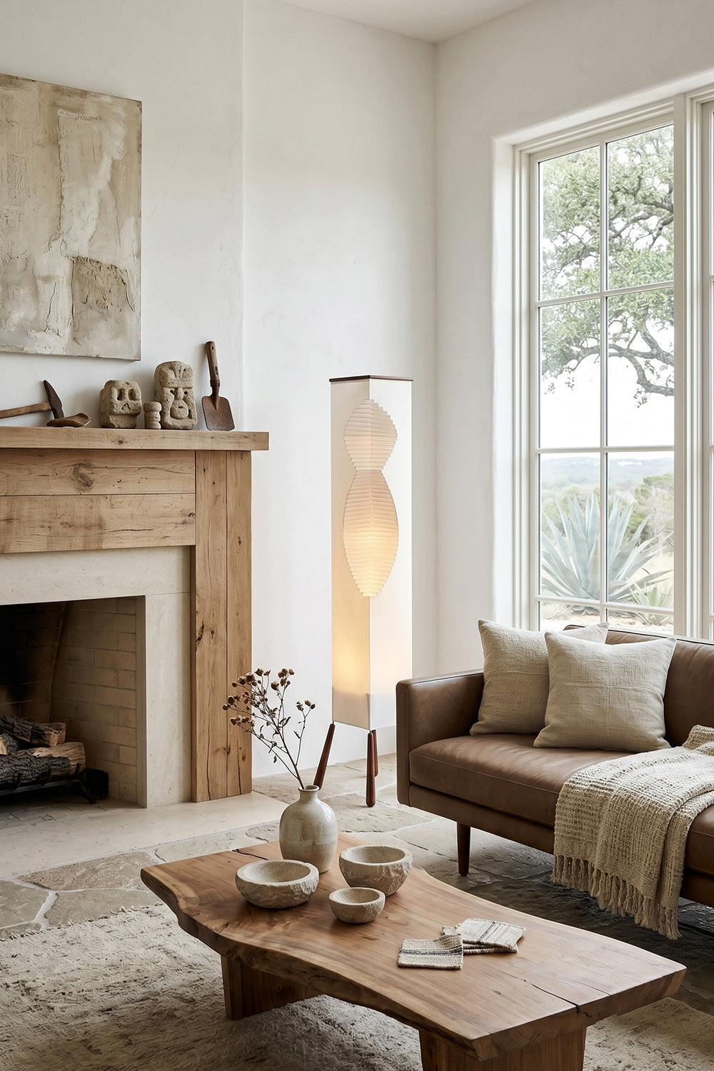 Nori Sculptural Leaf Floor Lamp | Fabric, Wood | Placed in a cozy living room corner next to a window, fireplace, and low wooden coffee table | vexa lamps