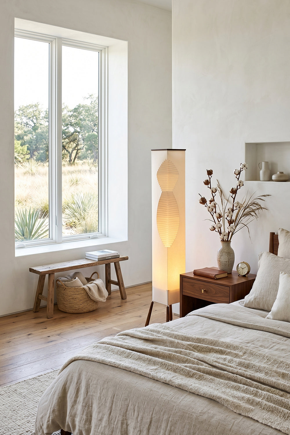 Nori Sculptural Leaf Floor Lamp | Fabric, Wood | Standing as a warm bedroom corner nightlight next to a window and cream bed linens | vexa lamps