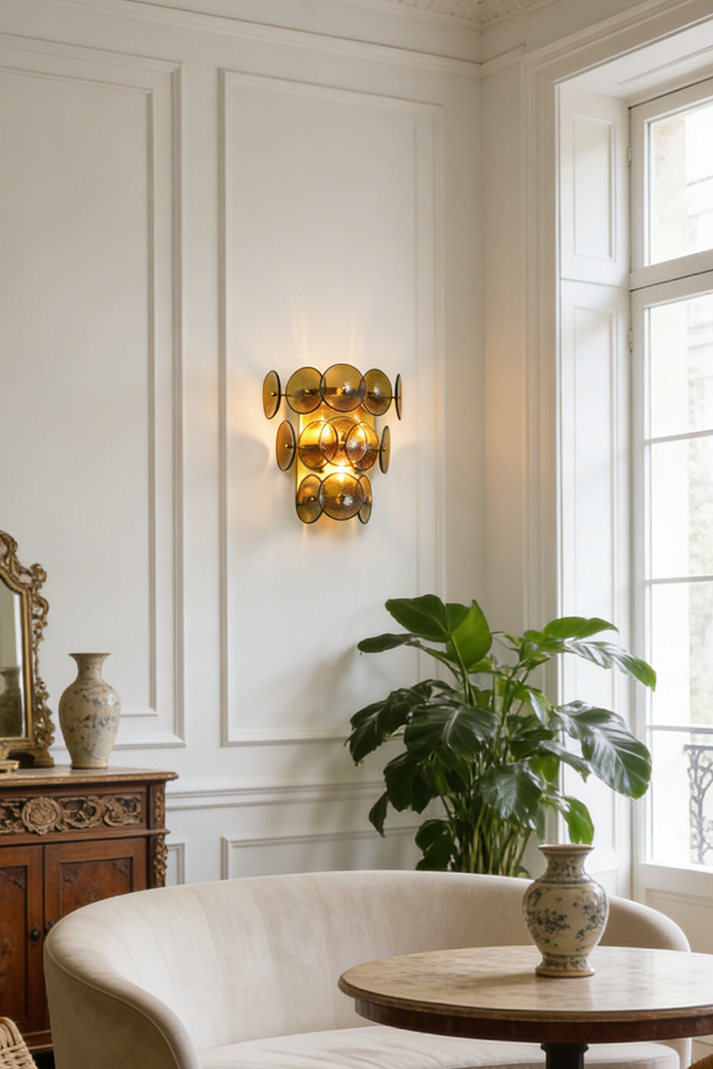 Lit olive green hammered glass wall light | Metal, Glass | Installed in a traditional living room by a window | vexa lamps