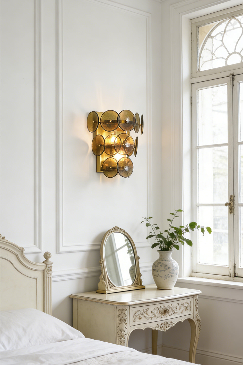 Lit olive green glass wall sconce | Metal, Glass | Installed in a classic bedroom near a white dresser and mirror | vexa lamps