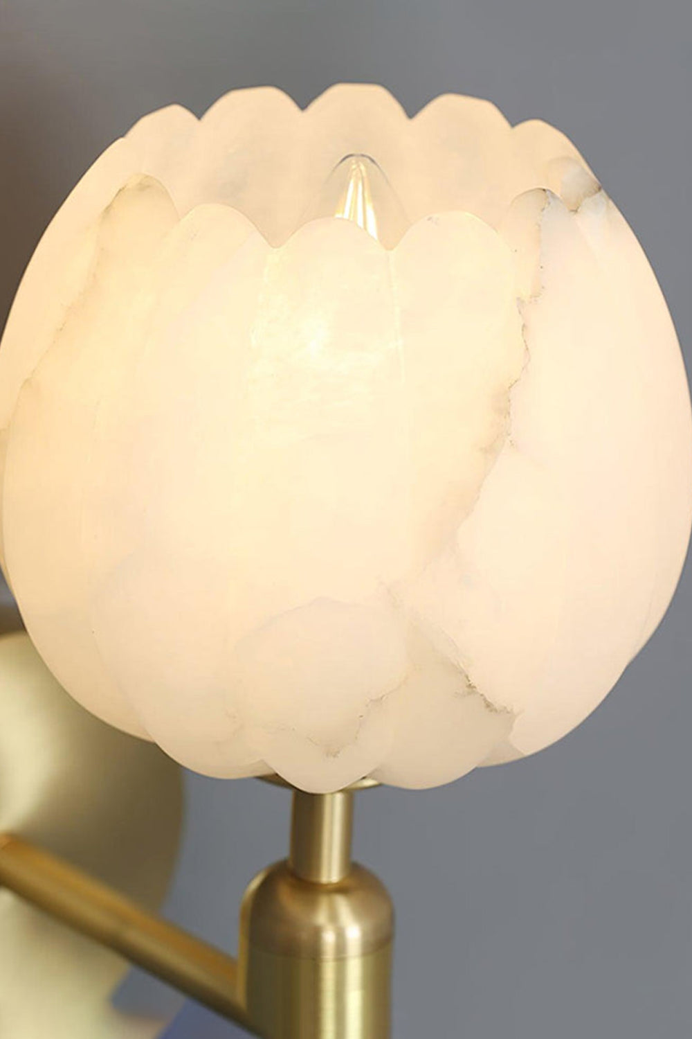Ondine Alabaster Blossom Wall Sconce | Natural Alabaster and Brass | Positioned in a sophisticated home office study room over a classic wooden desk and bookshelf | vexa lamps