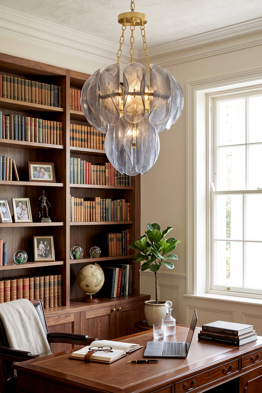 Ondine Cascading Leaf Glass Chandelier | Textured Smoked Glass and Gold Metal | Illuminating a sophisticated home library office filled with wooden bookshelves and a large executive desk | vexa lamps