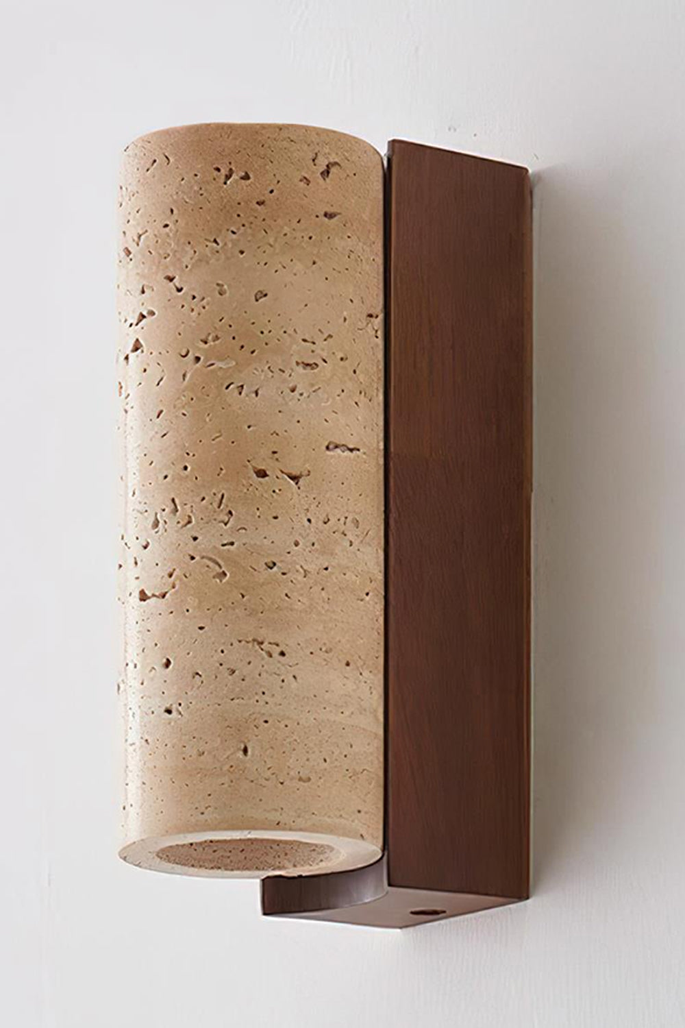 Outcrop Beige Travertine Wall Sconce | Travertine, Metal | Detailed close-up studio shot of the unlit stone sconce highlighting the porous pitted texture of natural beige travertine and dark bronze bracket | Detail shot | vexa lamps