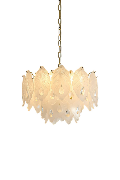 Pluma Frosted Glass Feather Chandelier | Glass, Metal | Fully illuminated modern luxury chandelier featuring overlapping frosted white glass feather panels with dangling clear crystal teardrops on a gold brass frame | Isolated lit product shot on white background | vexa lamps