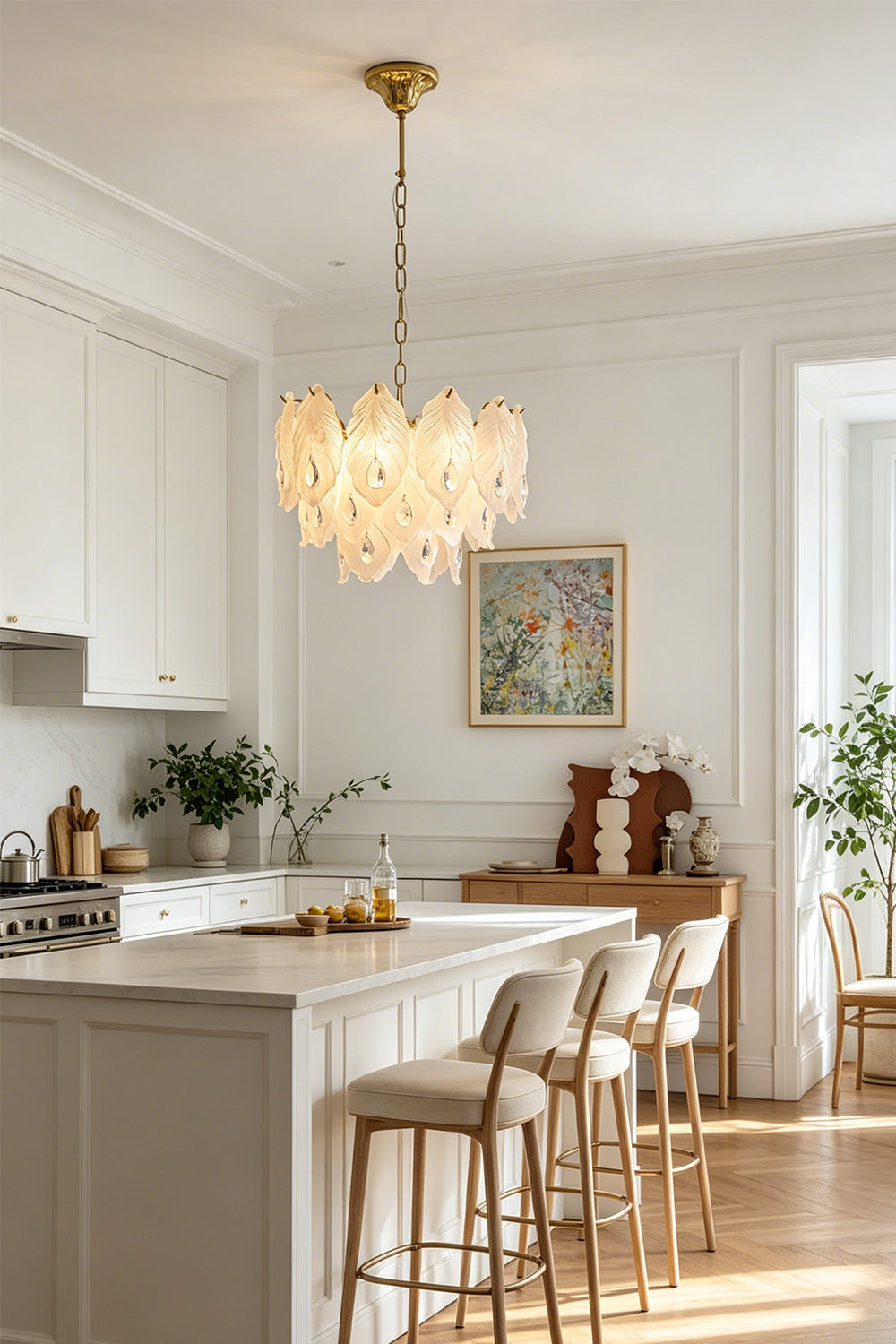 Pluma Frosted Glass Feather Chandelier | Glass, Metal | Suspended as an elegant statement accent light above a pristine white kitchen island counter with matching bar stools | vexa lamps