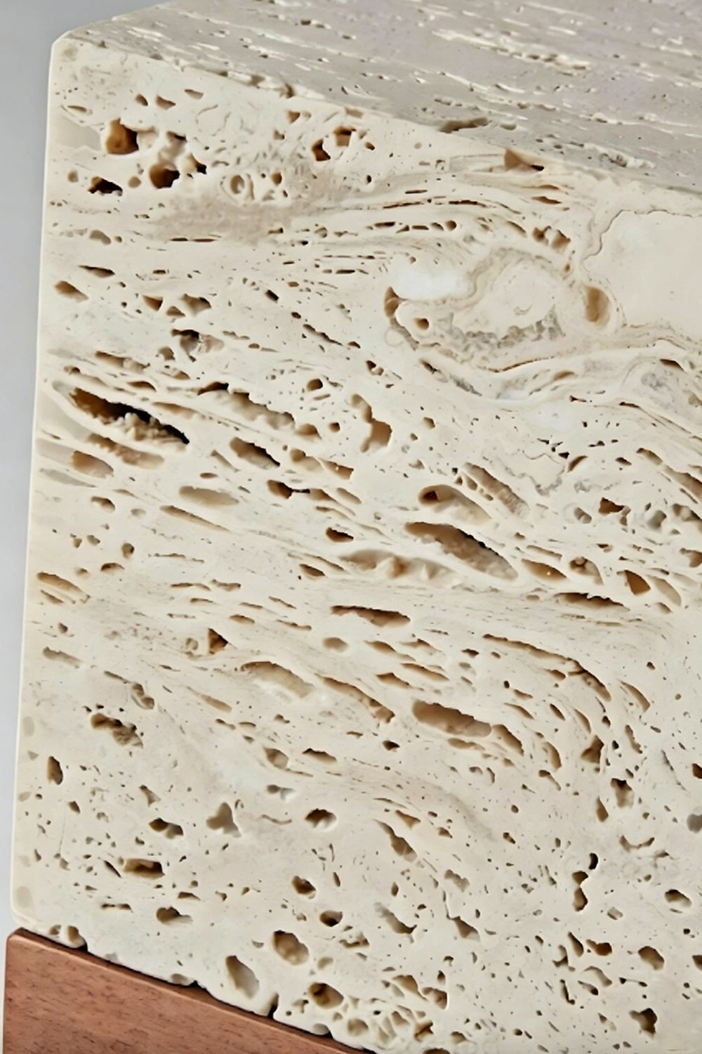 Radiant Monolith Travertine Table Lamp | Travertine | Extreme close-up surface texture | Porous stone voids and pits detail | Raw natural stone texture | vexa lamps