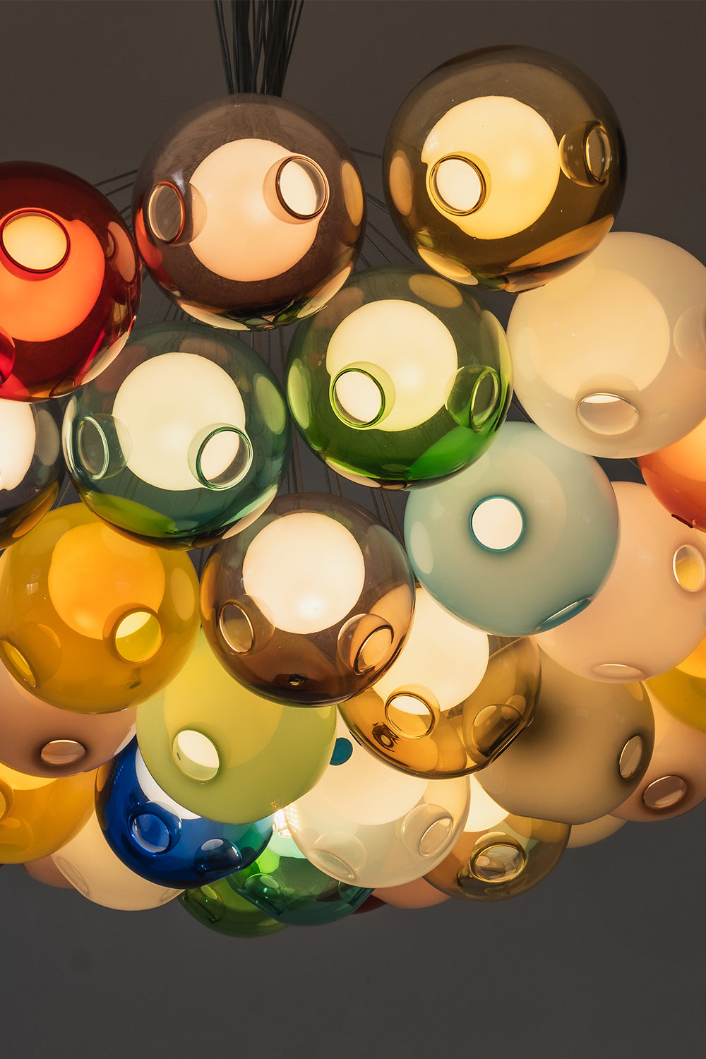 Rainbow Glass Bubble Cluster Chandelier | Glass, Metal | Underneath perspective looking up into the dense cluster of multi-colored translucent glass spheres | Detail shot | vexa lamps
