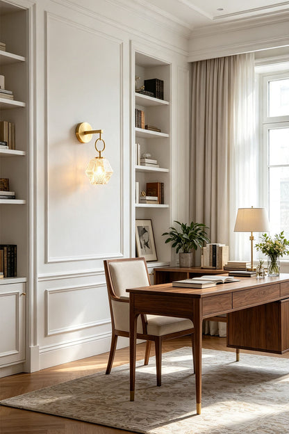 Rosamund Faceted Glass Wall Sconce | Faceted Glass and Brass | Illuminating a wooden desk in a bright home office space | vexa lamps