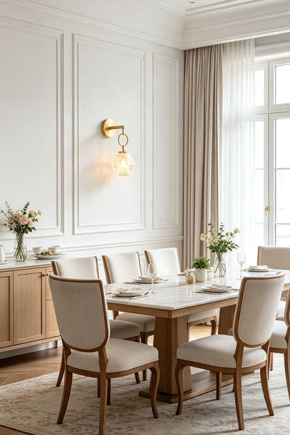 Rosamund Faceted Glass Wall Sconce | Faceted Glass and Brass | Enhancing a modern dining area with a wooden table and chairs | vexa lamps