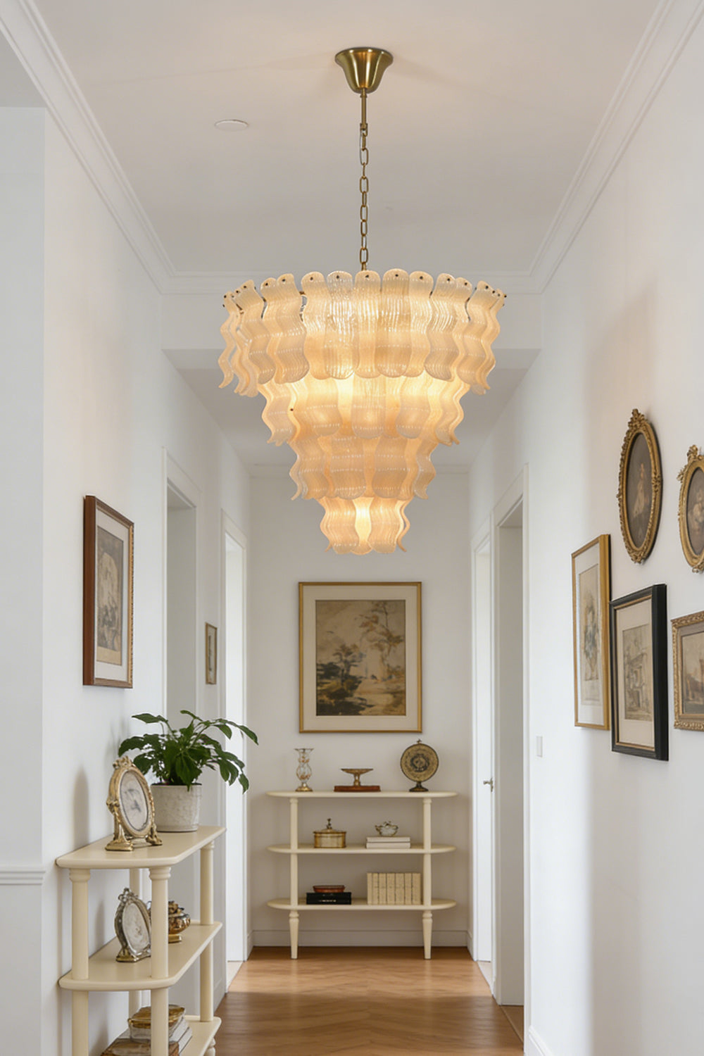 Luxurious tiered glass chandelier | Metal | Glass | Perspective view in a long bright hallway | vexa lamps