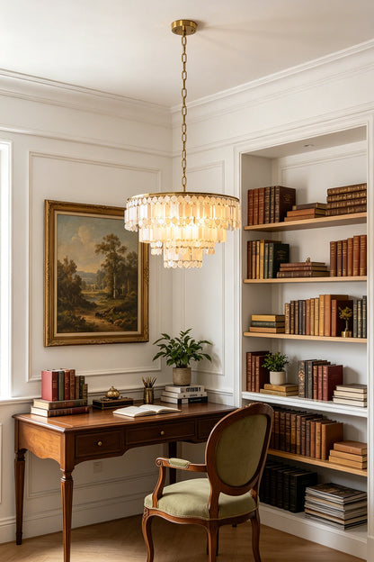 Seraphina Capiz Cascade Metal Chandelier hanging elegantly in a stylish study with bookshelves and a vintage painting.