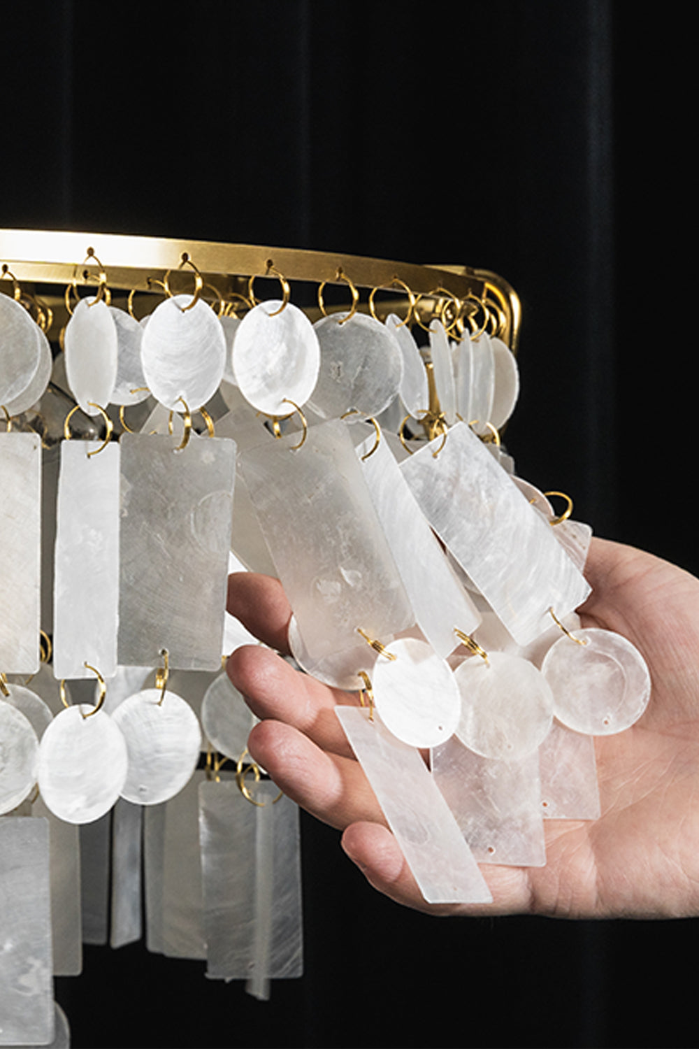 Seraphina Capiz Cascade Metal Chandelier showcasing hand-selected capiz shell discs in a satin gold frame.