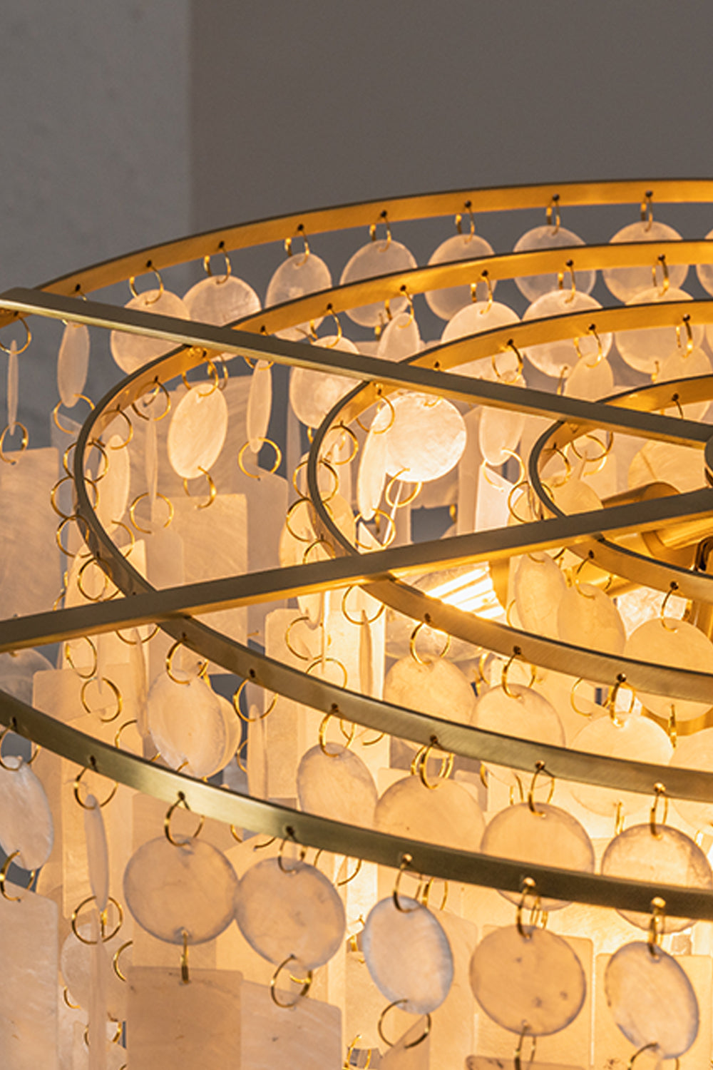 Seraphina Capiz Cascade Metal Chandelier showcasing capiz shells and satin gold-toned frame details.