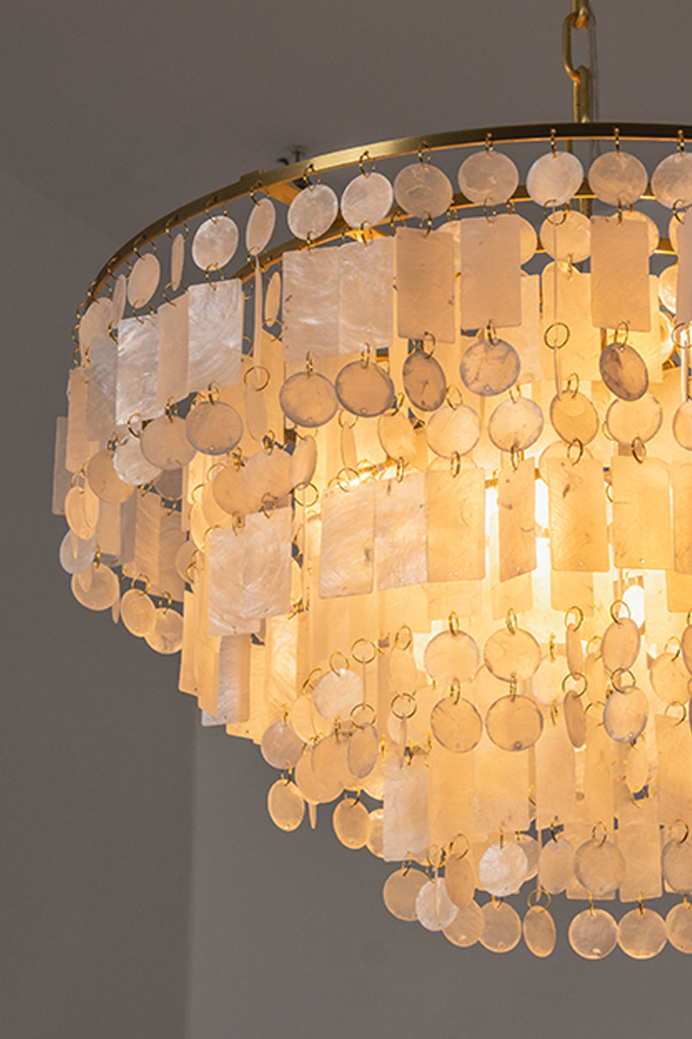 Seraphina Capiz Cascade Metal Chandelier with elegant capiz shell discs and warm gold frame.