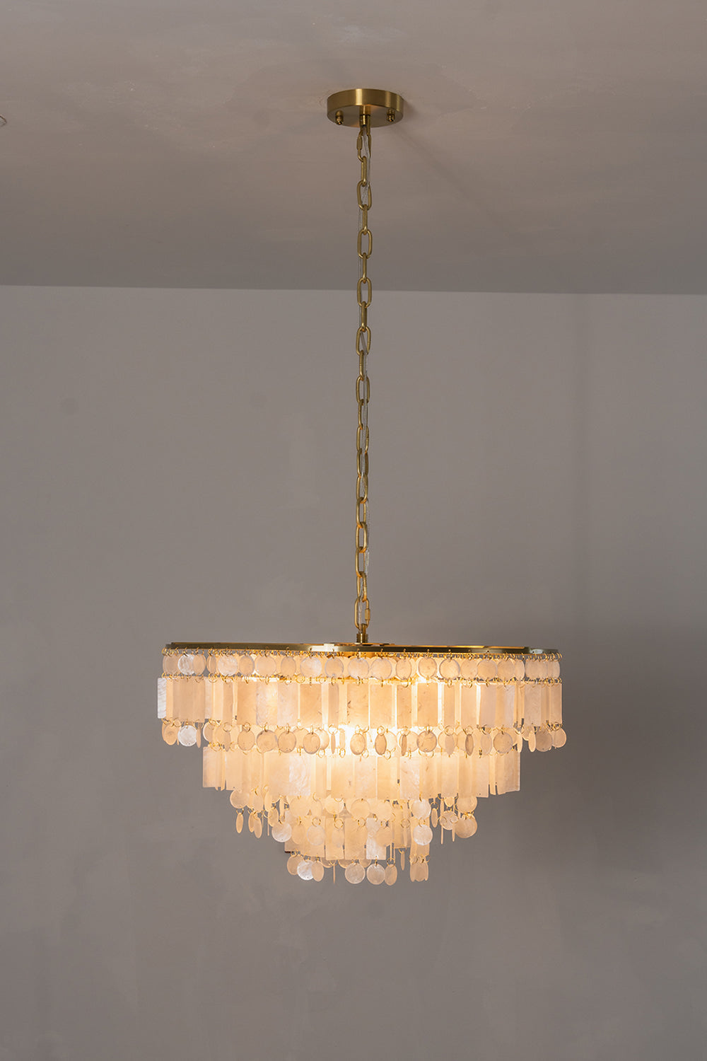 Seraphina Capiz Cascade Metal Chandelier hanging gracefully with capiz shell discs in warm satin gold.