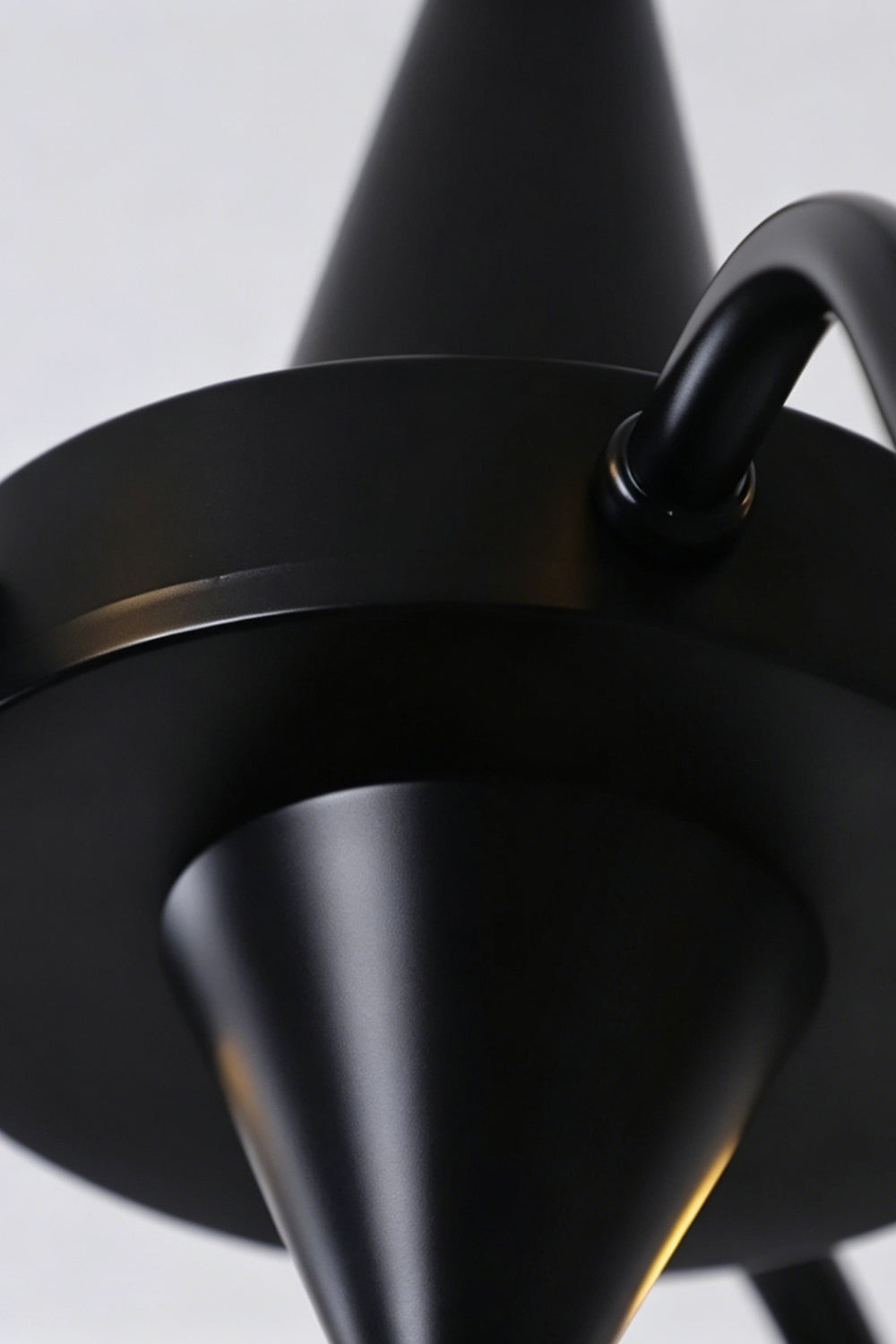 Seraphina Stained Glass Chandelier | Glass, Metal | Close-up focus on the matte black metal central body hub and curved arm connections | Detail shot | vexa lamps