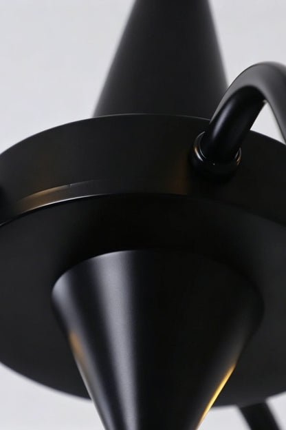 Seraphina Stained Glass Chandelier | Glass, Metal | Close-up focus on the matte black metal central body hub and curved arm connections | Detail shot | vexa lamps