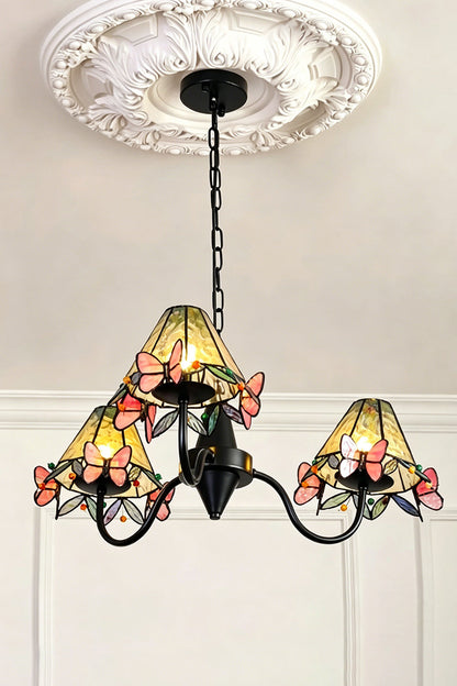 Seraphina Stained Glass Chandelier | Glass, Metal | Low-angle view of the fully lit multi-light chandelier hanging from a decorative white plaster ceiling rose | vexa lamps