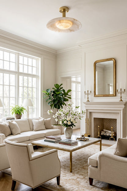 Solene Alabaster Round Ceiling Light | Living Room Accent Light | Staged in a bright luxury classical living room, radiating a warm cozy halo above cream fabric sofas and a traditional fireplace | vexa lamps