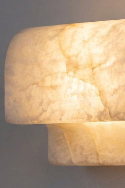 Soren Stacked Alabaster Wall Sconce showcasing natural alabaster with cloud-like veining, designed for elegant lighting.