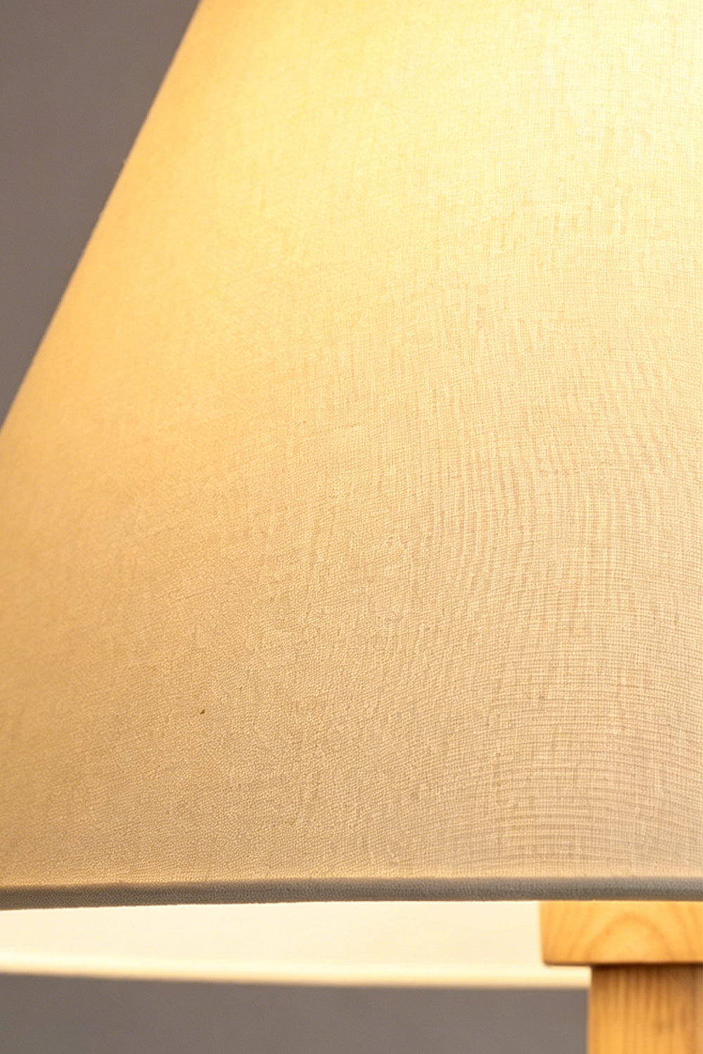 Sphaerica Lignum Wood Floor Lamp | Metal, Wood, Fabric | Macro shot of the textured beige fabric lampshade with a warm internal glow | Close-up | vexa lamps