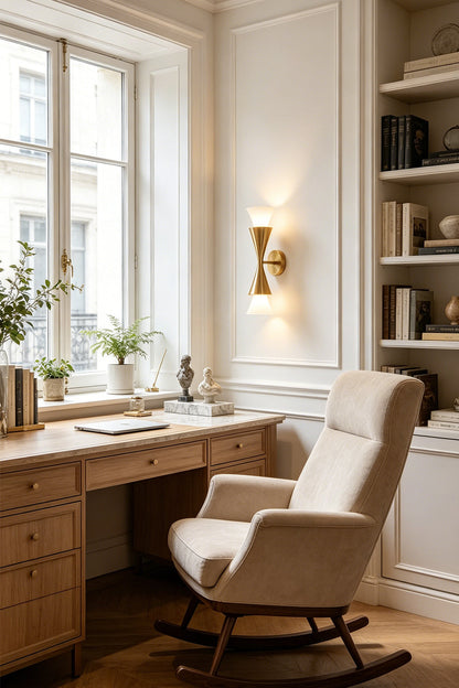 Stylish workspace featuring the Sylvain Modern Torch Wall Sconce, a mid-century inspired lighting fixture.