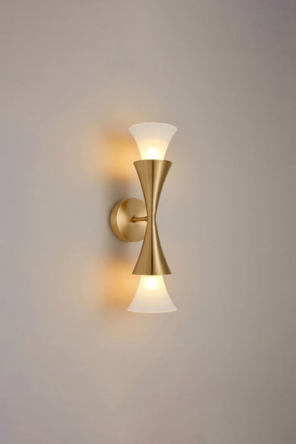 Sylvain Modern Torch Wall Sconce elegantly designed with a trumpet-shaped metallic stem and frosted glass shade.