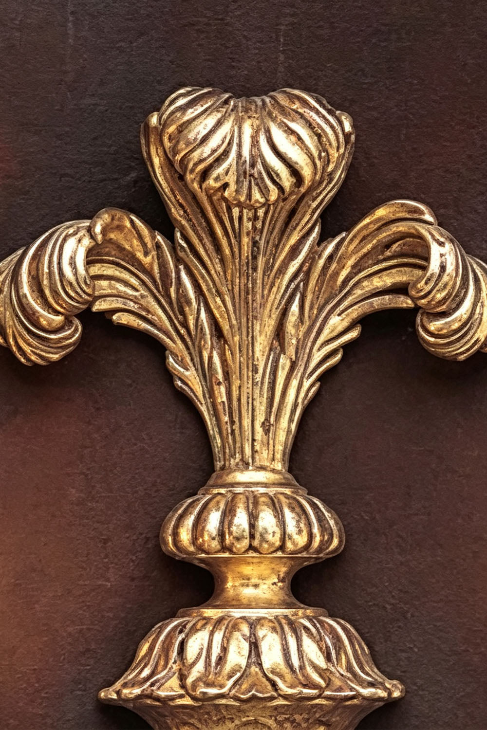 Tamsin Carved Plume Candle Wall Lamp | Carved Resin and Brass | Macro close-up showing the intricate carved plume ornament at the top | vexa lamps