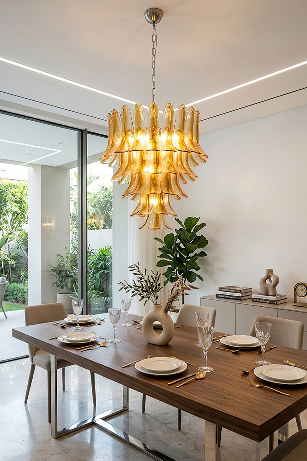 Amber lily petal chandelier over a wooden table | Metal, Glass | Bright modern dining room interior | vexa lamps