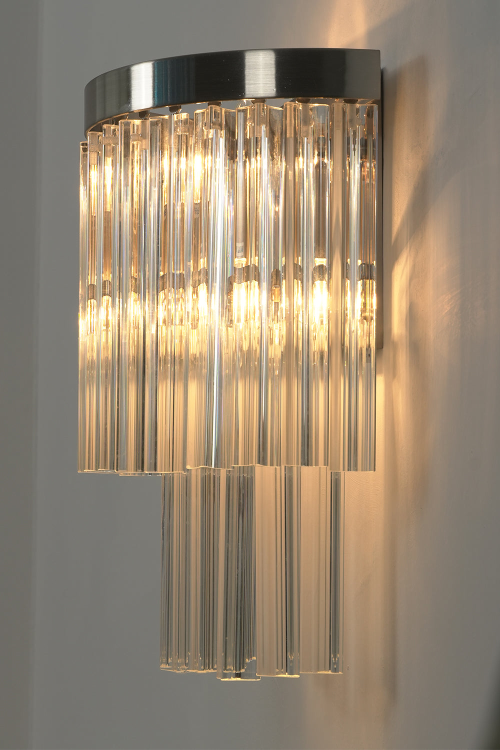 Angled close-up of lit glass rods | Metal, Glass | Detail view showing rod texture | vexalamps
