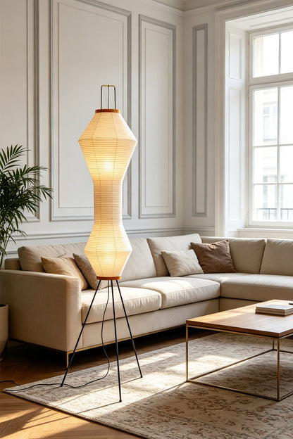 Verena Hourglass Paper Floor Lamp in a stylish living room setting with soft lighting.