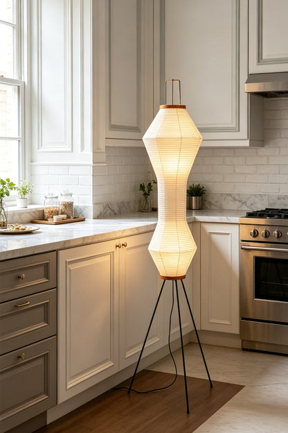 Verena Hourglass Paper Floor Lamp in a stylish kitchen, featuring a sculptural hourglass design and soft light.