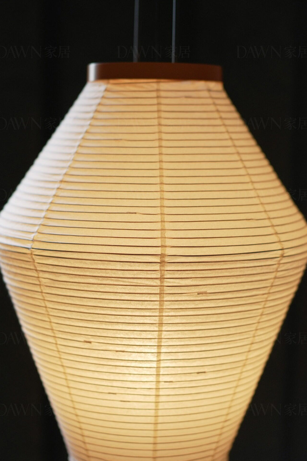Verena Hourglass Paper Floor Lamp showcasing an hourglass-shaped pleated paper shade with warm light.