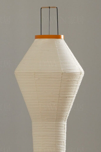 Verena Hourglass Paper Floor Lamp featuring a soft pleated off-white paper shade and bamboo-fiber frame.