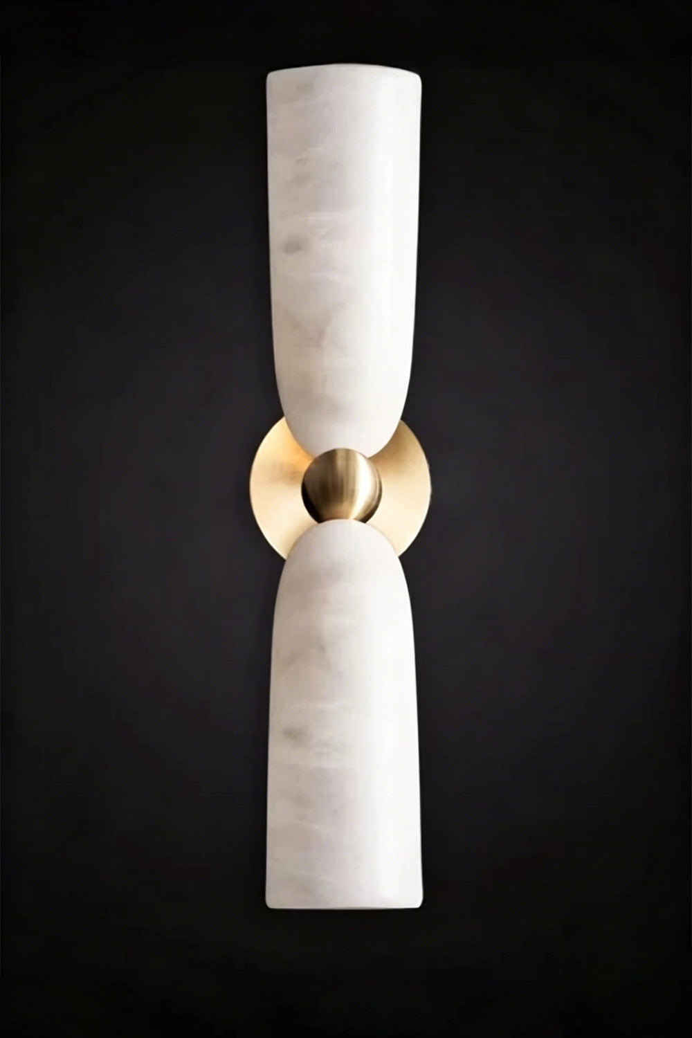 Vesperal Axis Alabaster Wall Lamp | Alabaster, Metal | Fully lit lamp showing the natural stone translucency against a dark dramatic background | Isolated product shot | vexa lamps