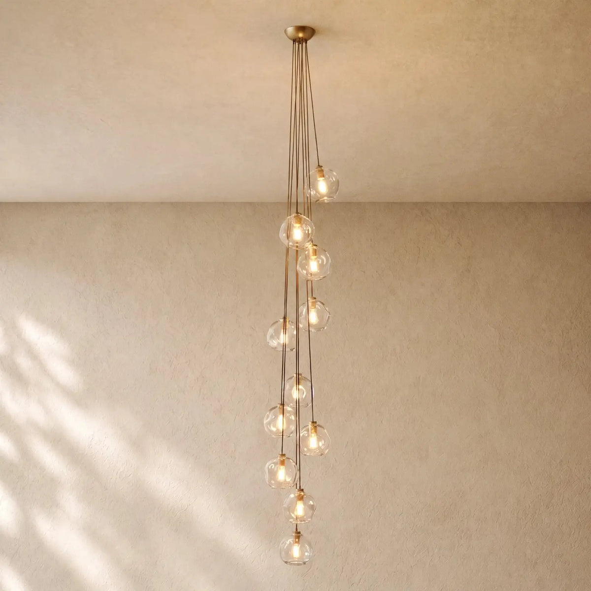 Bubble Glass Cascade Pendant - 11-Globe / Lacquered Burnished Brass / Clear