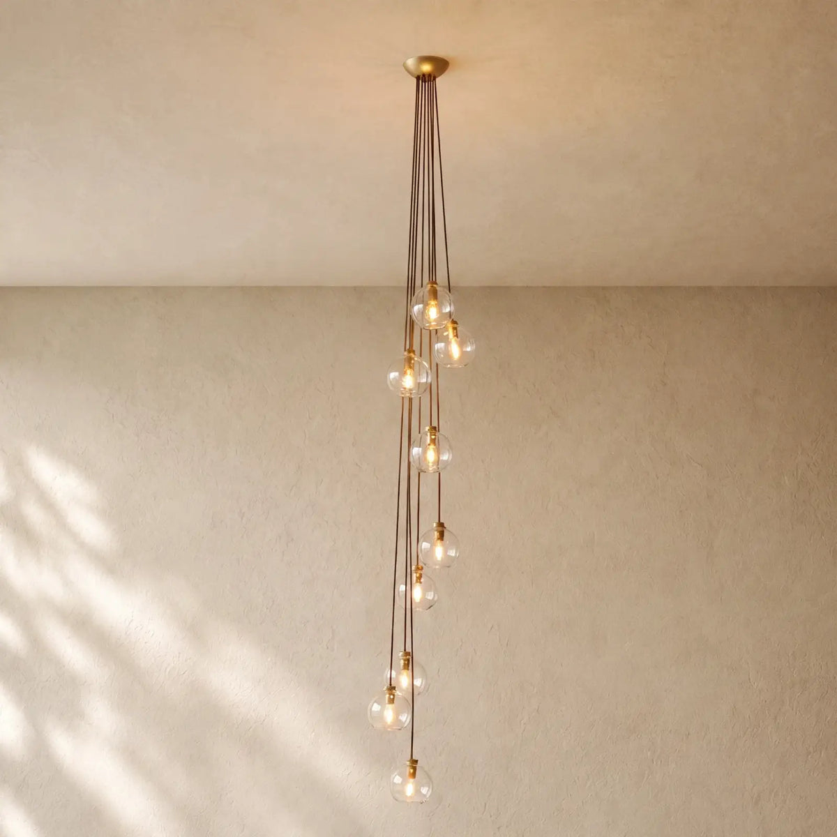 Bubble Glass Cascade Pendant - 9-Globe / Lacquered Burnished Brass / Clear